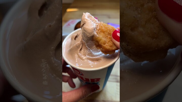 Dipping chicken nuggets in a frosty