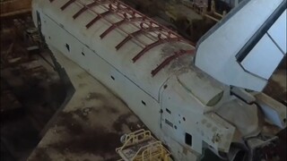 Abandoned Soviet space shuttle lies quietly in the hangar