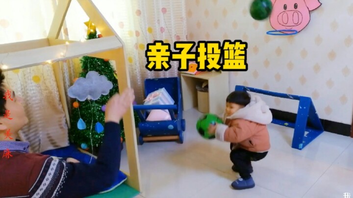 Dad made a pig-head basketball hoop out of a shipping box and practiced shooting with his kid—so hea