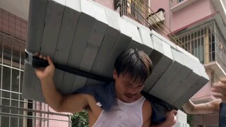 A tough-talking man challenges a day of moving bricks and resisting a building