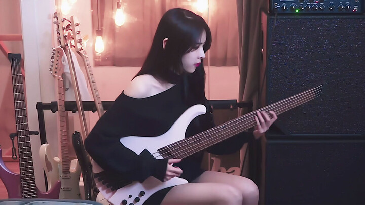 A small piece of bass slap by a girl in black dress