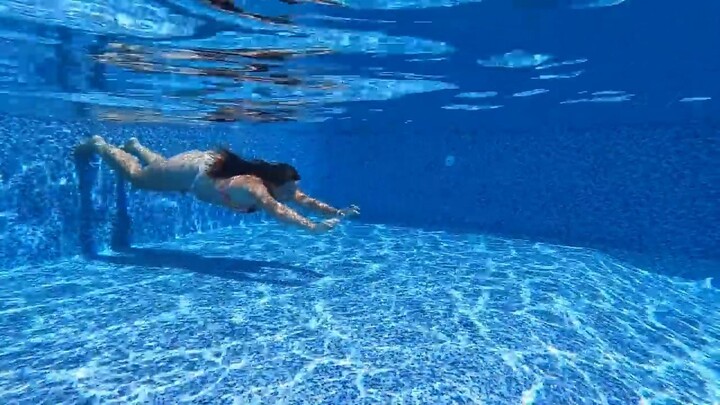 Swimming Underwater Unedited in Swimming Pool in Summer