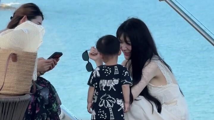 The little human baby leans in for a kiss—how could anyone resist? So cute!