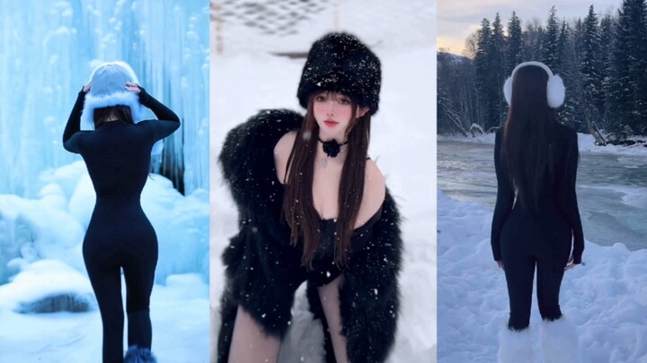On a snowy night, a beautiful woman walks through the snow!