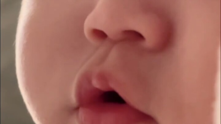After sleeping for 12 hours, I’m frantically hinting to Mom that I want milk—getting a bottle is rea
