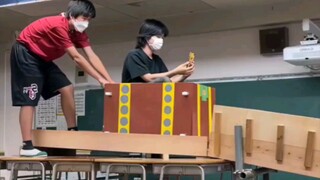 A roller coaster designed by students using desks at a high school cultural festival.
