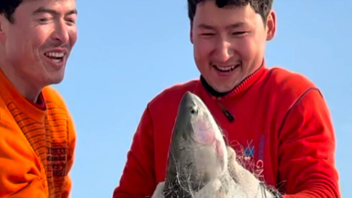 While others hibernate, I’m having a blast—catching fish on the frozen lake and having a wild time!