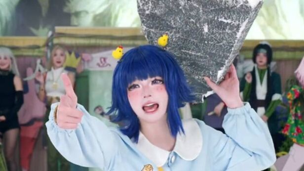 Hinata lifts the huge rock about to fall on Kakashi, saving her in-laws