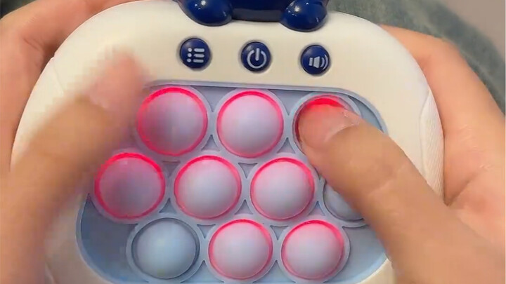 Sneaking a play with my little nephew's push-button toy—hahaha! It's so addictive; I just can't stop