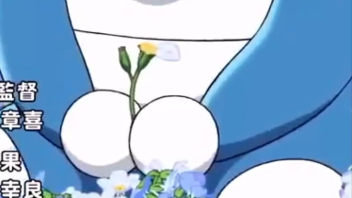 doraemon memegang bunga