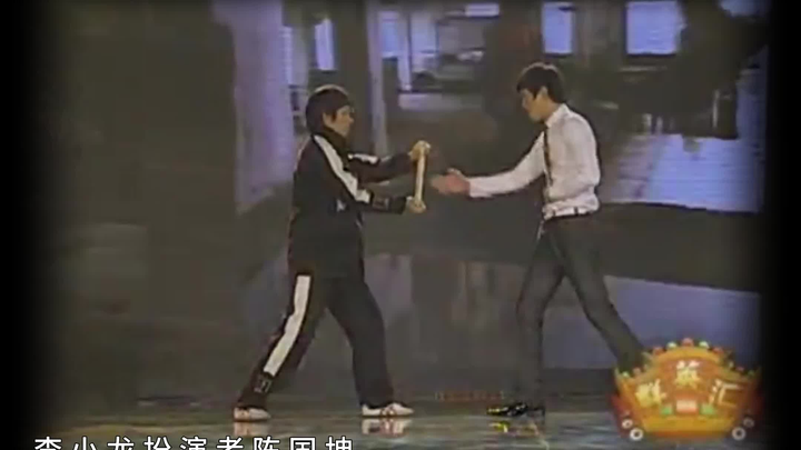 Bruce Lee and Bruce Lee’s actor, Chen Guokun, performing the inch punch.