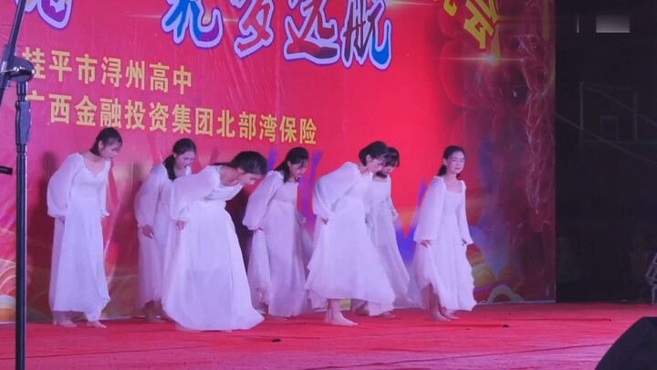 High School Girl Performs Barefoot in the Dance Piece “Tian Yu”