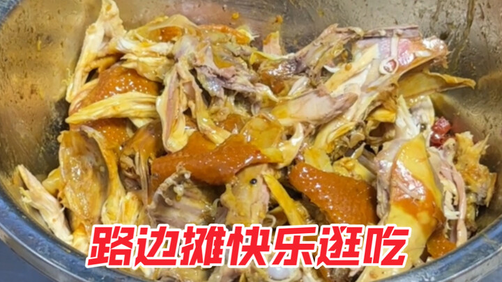 A young man enjoys a feast at a street-food stall—various food stands offer free‑mix combinations, a