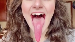 How long can a human tongue be?... One sister can actually lick a little tongue