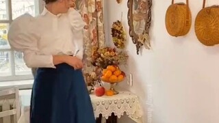 Young lady tries on vintage clothing from 1896