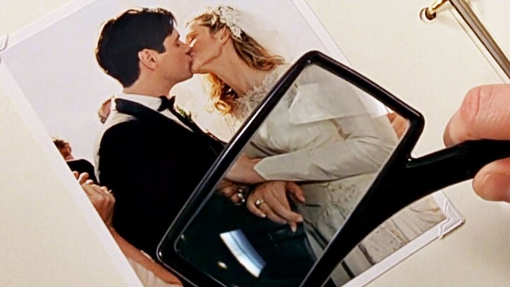 While looking at old wedding photos, the husband noticed his wife’s strange finger movements—only to
