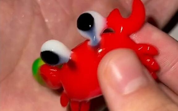 Toy. How could you bear to eat such a cute little crab?