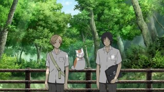 Tanuma listens carefully to the cat teacher's instructions