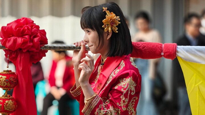 CC carrying the flag from a bystander's perspective while confiscating phones