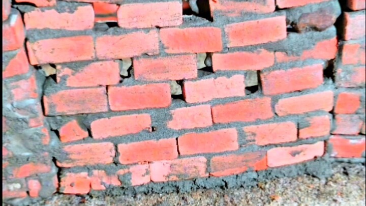Watch a realistic DIY mini brick house construction using tiny bricks, cement, paint, and miniature