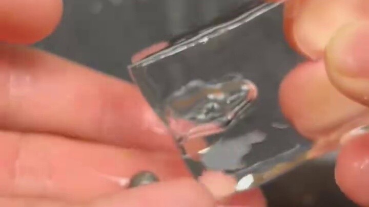 Mini red balls placed in ice cubes [FloridaFox Anthill Art]