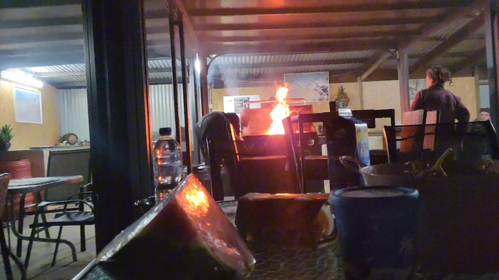 I was eating in the campsite’s communal kitchen when I saw an older guy cooking with a blazing fire—