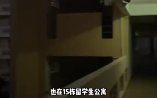 A female visitor tours the single dorm room of a Pakistani student at Hainan University—must say, th