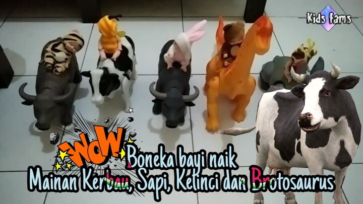 boneka bayi naik kerbau