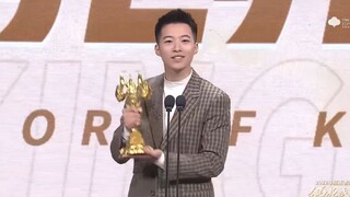69-year-old leans against the wall to receive the award