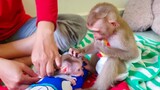 Hello Brother!! Little Yaya gently comforts tiny Luca while Mom is busy putting on a new diaper