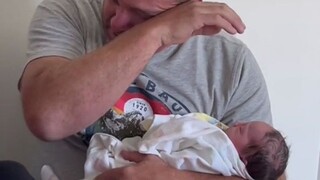 Grandpa couldn't hold back when he saw his newborn granddaughter
