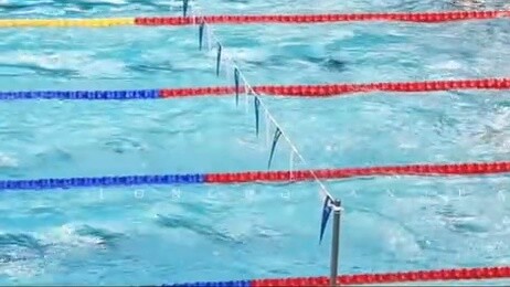 Swimming the 100m individual medley in the midst of a bustling crowd was like a grand wedding with b