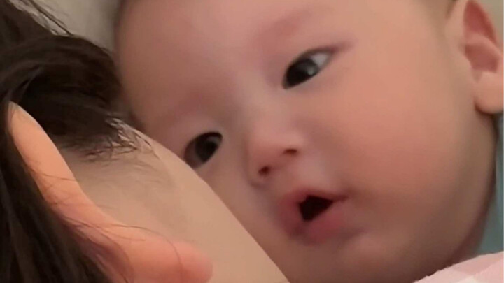 A chatty little baby, babbling one infant phrase after another without stopping!