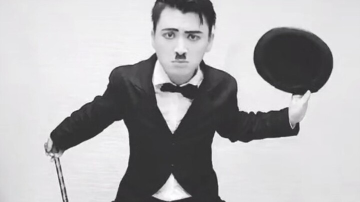 A spirited young man imitates Chaplin's dance