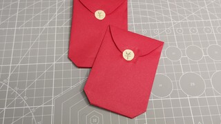 Origami buatan tangan amplop merah yang paling umum dapat dipelajari dalam satu menit, dan Anda tida