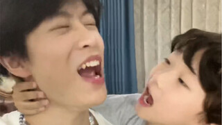 Is this kid a woodpecker? He's so good at kissing!