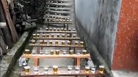 On his wedding day, the groom went to pick up the bride and found the doorway lined with bottles of 