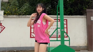 A dancer who has been practicing for a year and a half comes to the basketball court to dance