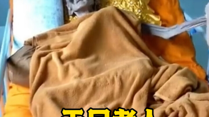 An elderly person abroad who looks like a mummy