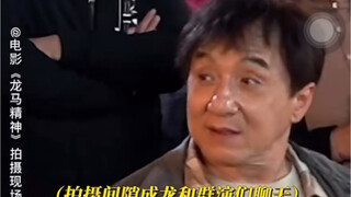 Jackie Chan chats with extras on the set