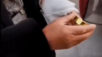 An elderly man shows off his ancestral gold brick—it’s really nothing like the ones today…