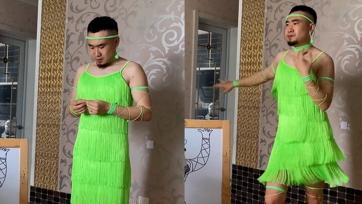 Ayah mengenakan rok bertali hijau neon dan menari tarian Latin hanya untuk menjadi model bagi putran