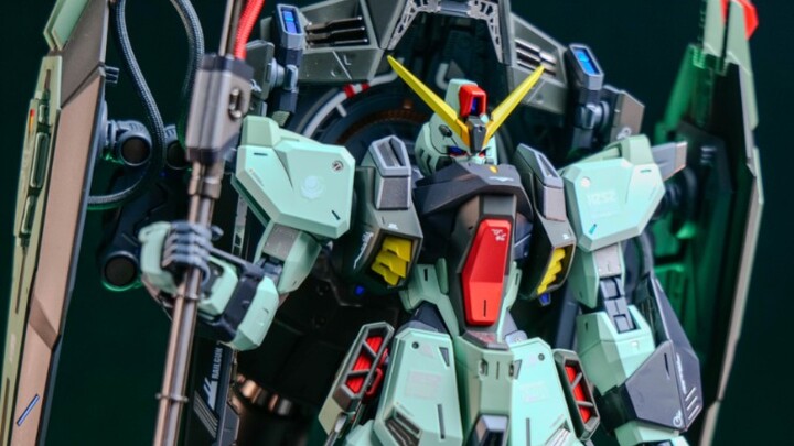 The green one in the seed may not be the top of Aslan's head, it may also be the Forbidden Gundam