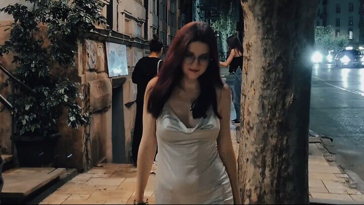 A walk through Tbilisi at night in a gold evening gown.