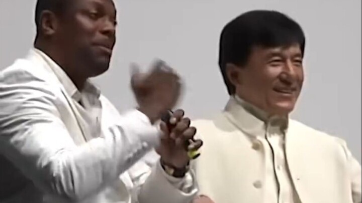 Jackie Chan passionately embraces his "Rush Hour" co-star Chris Tucker after many years, sharing the