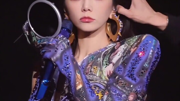 44-year-old Ella Chen Jiahua’s already wearing reading glasses—catching her live on camera touch up 