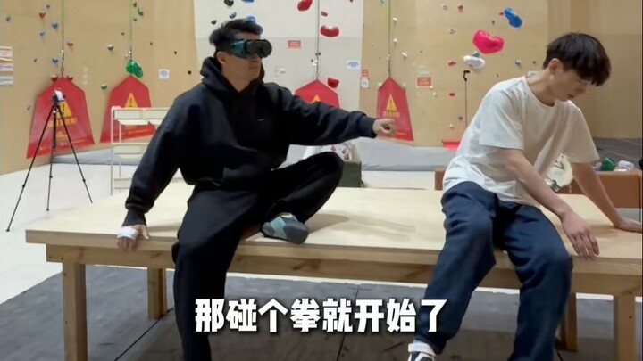 Competing in a table-climbing challenge against a blind rock climbing champion