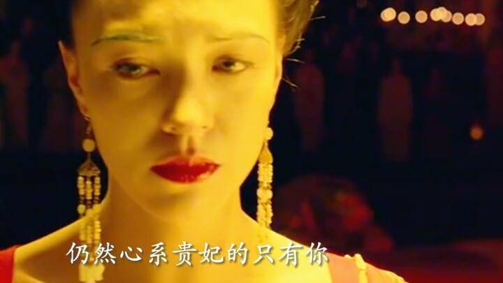 Clouds yearn for her robes, flowers long for her face; the spring breeze brushes the railing, dewdro