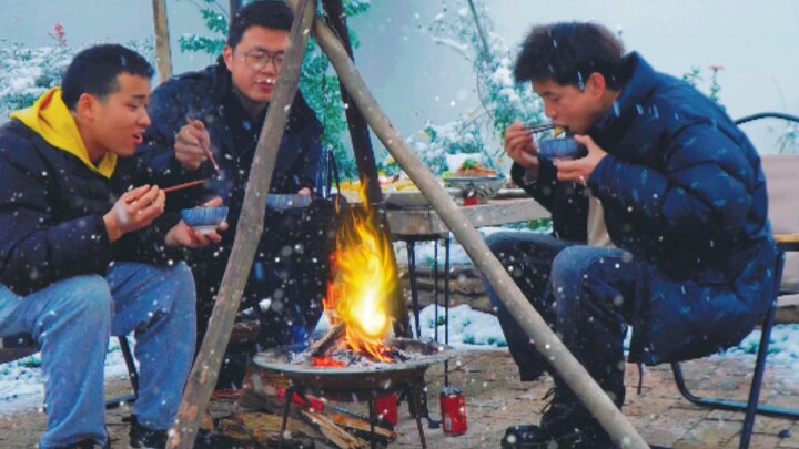 Snowflakes swirl as we feast on meat by the hearth.