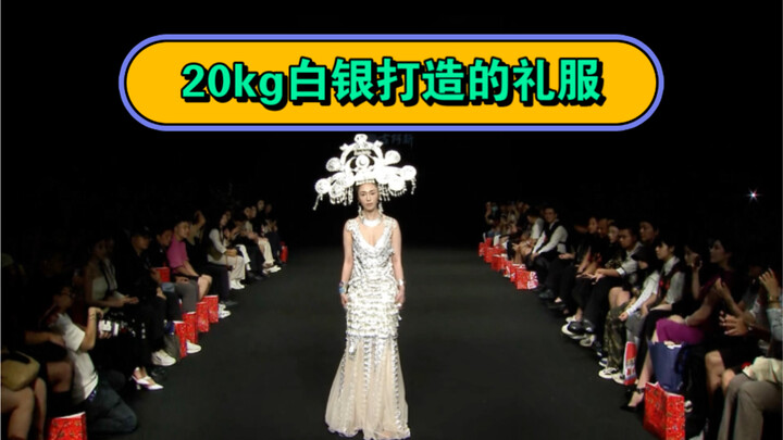 20 kg of silver, 1,600 pieces, and over 200 hours of craftsmanship to create a gown that flows like 